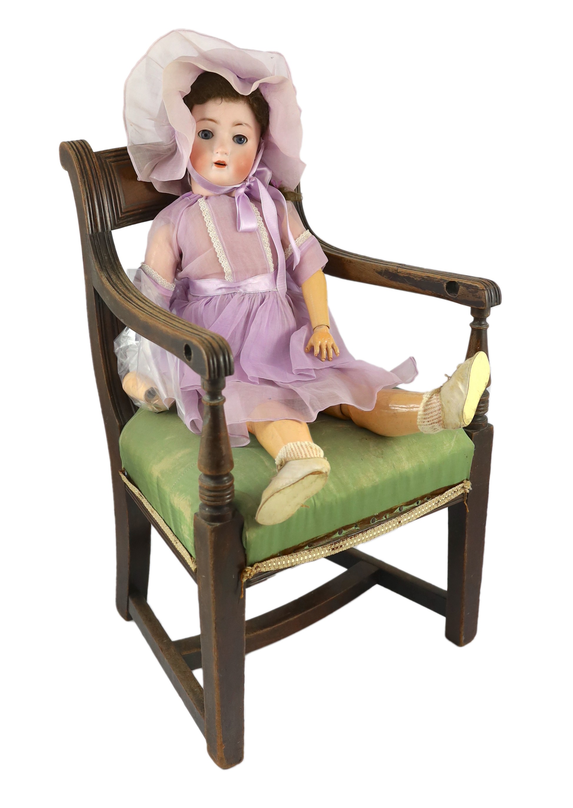 An Alt, Beck & Gottschalck bisque doll, German, circa 1912, 23in. Please note the chair is for display purposes only.